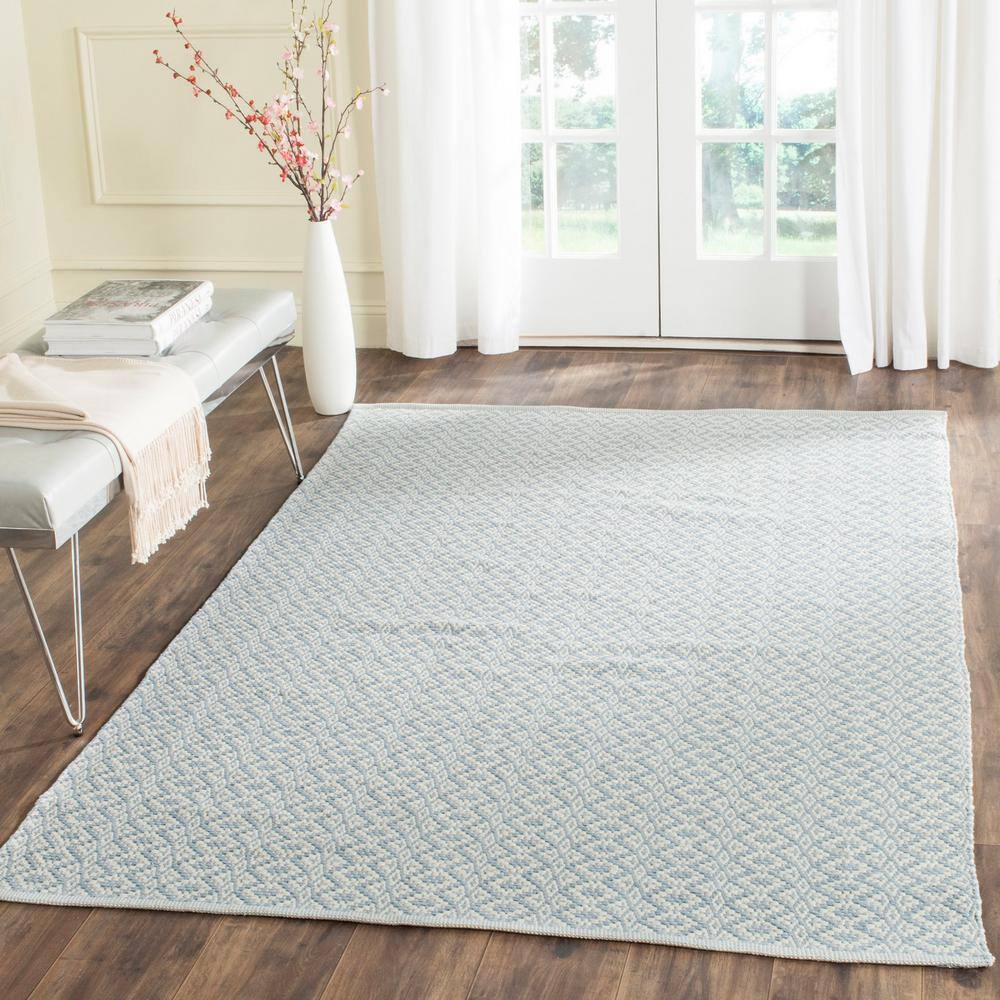 Montauk Ivory/Light Blue 5 ft. x 7 ft. Solid Area Rug - Hercitys