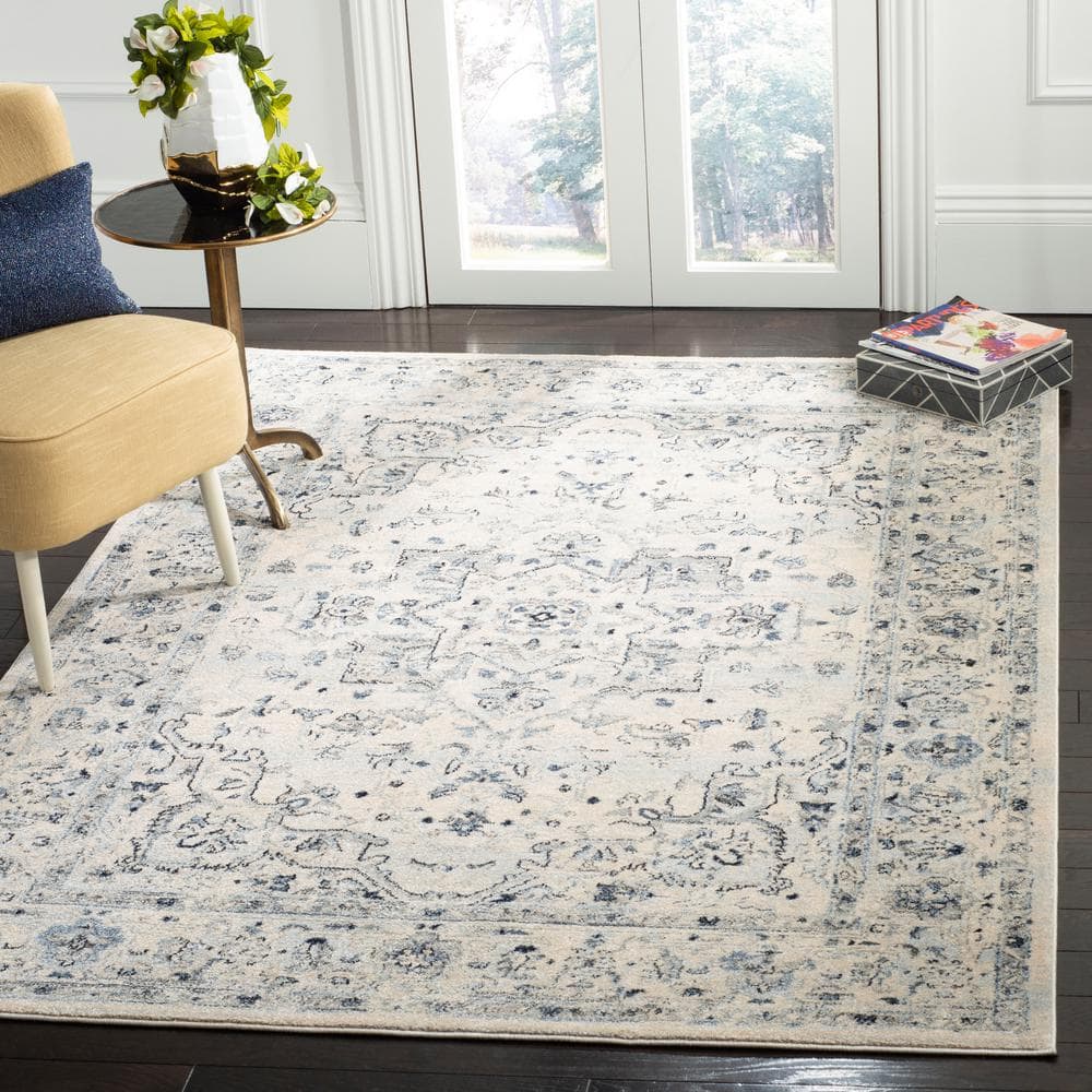 Charleston Ivory/Light Blue 9 ft. x 12 ft. Distressed Border Area Rug - Hercitys