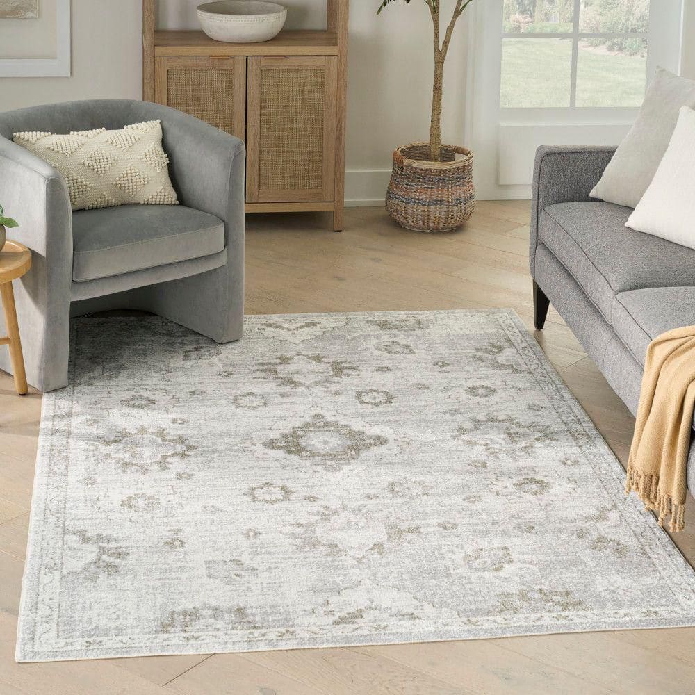 Astra Machine Washable Ivory 5 ft. x 7 ft. Distressed Traditional Area Rug - Hercitys